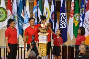 (From left) Tony Low, chairman of Singapore School Sports Council; Education Minister Ong Ye Kung; Zikos Chua (football) from Nanyang JC; Adelina Cheok (rope skipping) from Edgefield Primary; Singapore Primary School Sports Council chairman Lee Hui Feng light the cauldron during the National School Games opening ceremony at the OCBC Arena on Jan 21, 2020.ST PHOTO: CHONG JUN LIANG